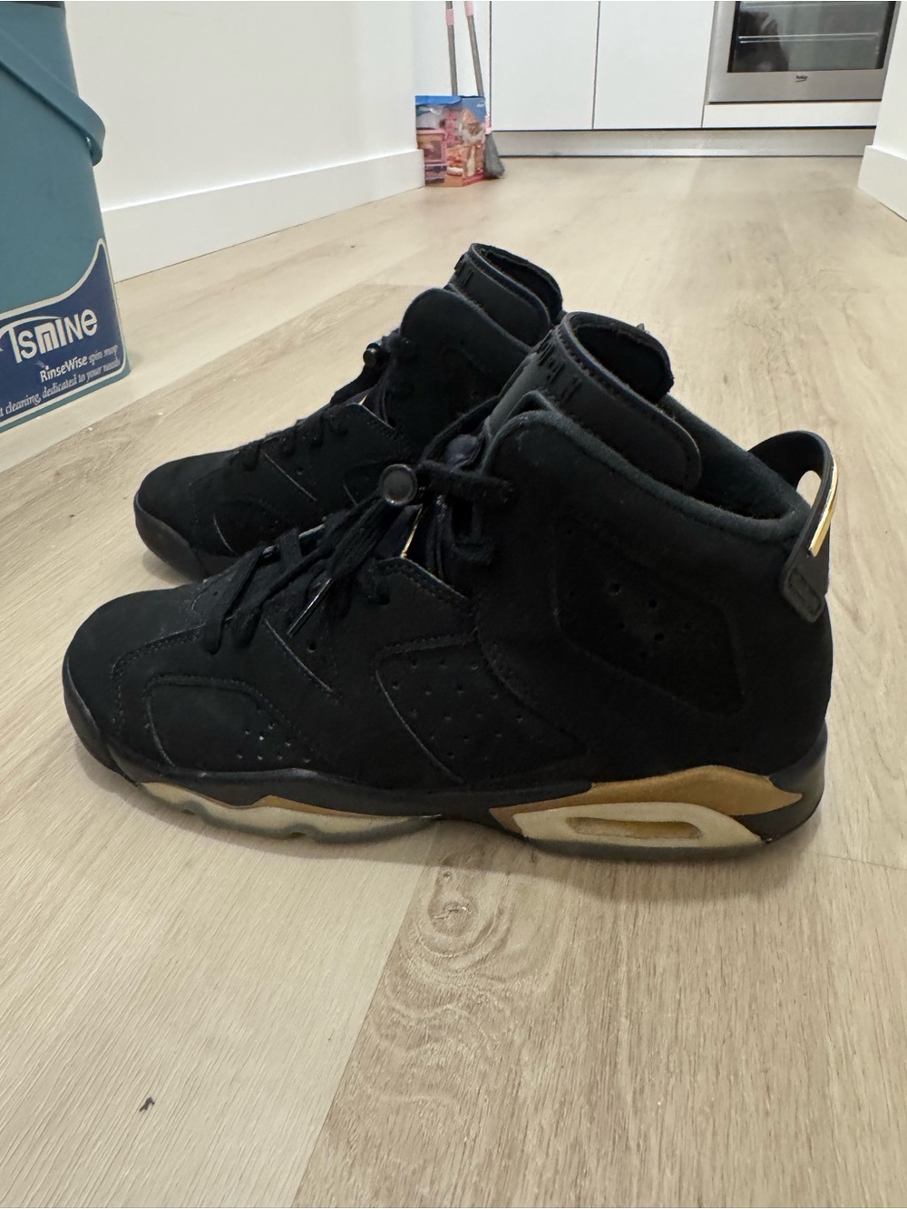 Jordan Black High-Top Sneakers with Gold Detailing
